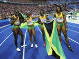 AFP/„Scanpix“ nuotr./Jamaikietės nesunkiai laimėjo estafetę