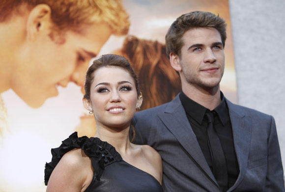 Scanpix nuotr./Miley Cyrus nekantrauja sulaukti savo pilnametystės, kad kuo greičiau ištekėtų už Liamo Hemswortho. 
