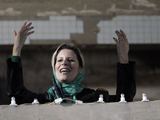 AFP/„Scanpix“ nuotr./Aisha Kadhafi