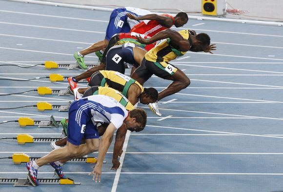 Reuters/Scanpix nuotr./Usainas Boltas buvo diskvalifikuotas 100 metrų finale