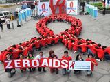 AFP/„Scanpix“ nuotr./Pasaulinės kovos su AIDS dienos minėjimas