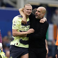 Erlingas Haalandas ir Josepas Guardiola.