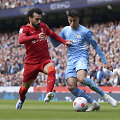 Mohamedas Salahas ir Joao Cancelo
