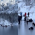 Turistai ant plono ežero ledo Tatruose