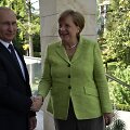 Vladimiras Putinas ir Angela Merkel Sočyje