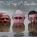 Klimato kaitos aktyvistai demonstruoja Vladimiro Putino (centre) atvaizdą / Asociatyvinė nuotr.