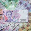 Ukrainos grivinos banknotai nuotraukoje i&scaron; Kijevo. / Konstantin Chernichkin / REUTERS