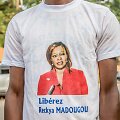 Reckya Madougou atvaizdas ant mar&scaron;kinėlių