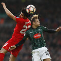 Emre Canas ir Oscaras Threlkeldas