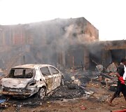 Sprogimo padariniai Džoso turgavietėje, Nigerijoje.