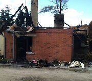 Sudegęs pastatas praėjus kelioms dienoms po gaisro