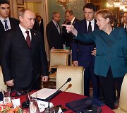Vladimiras Putinas ir Angela Merkel