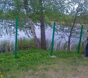 Aplinkosaugininkai pradėjo griauti neleistinas tvoras prie vandens telkinių