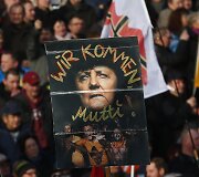 Europoje surengti prie&scaron; pabėgėlius nukreipti protestai