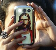 Mobilusis telefonas su Jėzaus Kristaus atvaizdu.