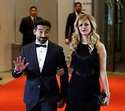 Ezequielis Lavezzi su drauge Yanina Screpante