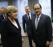 Angela Merkel ir Francois Hollande'as