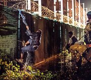 Migrantai Prancūzijoje mėgina pasiekti Didžiąją Britaniją per Eurotunelį