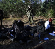 Migrantai Lenkijos pasienyje