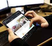 Seimo nario M.Matijo&scaron;aičio telefonas / stop kadras i&scaron; 15min reportažo