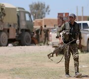 Sirijos Kurdų apsaugos būriai ginasi nuo Islamo valstybės kovotojų