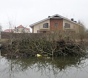 Užlieta pieva sodų bendrijoje