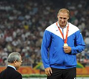 Olimpinis auksas jau ant atleto krūtinės