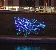 Lazeriais sukurta &scaron;viesos projekcija Neries krantinėje