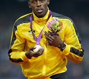 Jamaikietis Usainas Boltas laimėjo aukso medalius 100 m ir 200 m bėgimo rungtyse