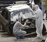 Tyrėjai sprogimo vietoje