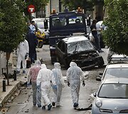 Tyrėjai sprogimo vietoje