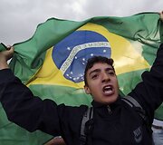 Protestuotojas su Brazilijos vėliava