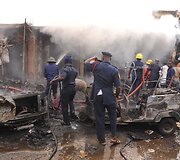 Sprogimo padariniai Džoso turgavietėje, Nigerijoje.