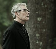Stephenas Langas filme &bdquo;Apsėstieji&ldquo;