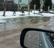 Nemėžio A.Mickevičiaus gatvė per pavasarinį polaidį