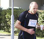 Nidos pusės maratono bėgimas