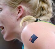 Australijos krep&scaron;ininkė savo patriotizmą demonstruoja i&scaron;tatuiruota vėliava.