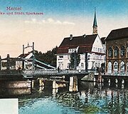 Biržos tiltas, miesto taupomosios kasos (kairėje) ir &bdquo;Salamander&ldquo; pastatai. Tolumoje &Scaron;v. Jono bažnyčios bok&scaron;tas, XIX&ndash;XX a. ribos Roberto Shmidto leidyklos i&scaron;leistas atvirukas. Aleksandro Kubilo archyvas