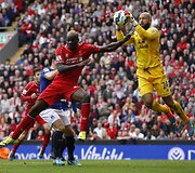 Mario Balotelli ir Timas Howardas