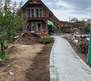 Irena kartu su vyru atnaujino sodo namelį