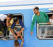 Migrantai traukiniuose