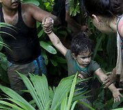 Kubos migrantai braunasi pro Kolumbijos džiungles norėdami pasiekti JAV