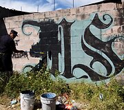 Salvadoro policija užpai&scaron;o gaujų paliekamus grafičius ir kitokius pie&scaron;inius