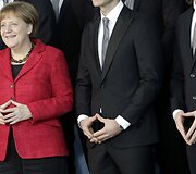 Angela Merkel su savo komandos nariais