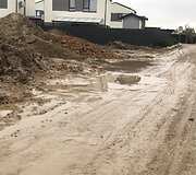 Romaini&scaron;kių gatvė Kaune virto purvynu