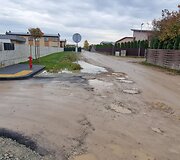 Už sąvartos zonos esančios Romaini&scaron;kių gatvės ir jos &scaron;alutinių gatvių būklė