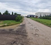 Už sąvartos zonos esančios Romaini&scaron;kių gatvės ir jos &scaron;alutinių gatvių būklė