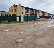 Už sąvartos zonos esančios Romaini&scaron;kių gatvės ir jos &scaron;alutinių gatvių būklė