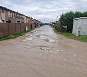 Už sąvartos zonos esančios Romaini&scaron;kių gatvės ir jos &scaron;alutinių gatvių būklė