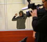 Į teismą atvestas sutuoktinių pražudymu įtariamas jaunuolis